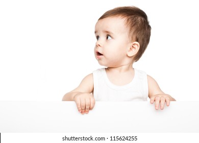 Cute baby boy holding empty blank board isolated on white background