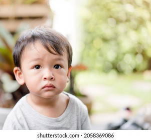 Cute Baby Boy Looking Up To Camera With Question Mask Face.Portrait Of Asian Baby Child Kid.Handsome Foster Child With Stubborn Face.First Talk With Mom.childhood Family.1 Years Old Kid With Hungry.