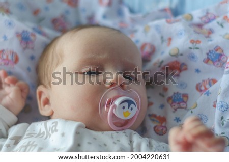 Similar – Baby asleep while parents caress