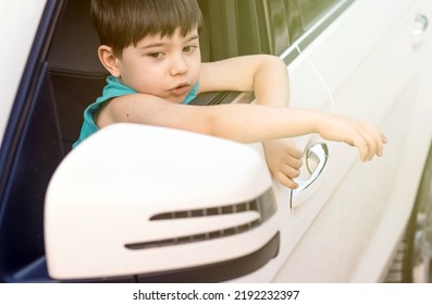 Cute Baby Boy On Driver Seat With Hands Head Outside Expressing Hooray Ready For Trip.kid Have Fun While Parents Embarking.road Trip Travel Tourism Concept.opened Car Door Window Sunshine Summer 