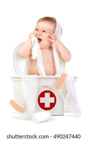 Cute Baby Boy Playing With Bandages In A First Aid Kit Box.