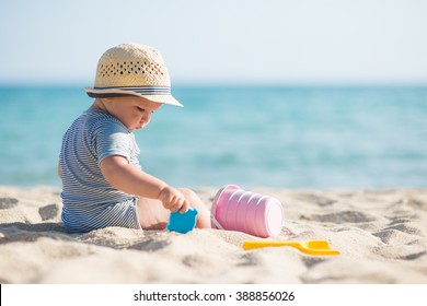 Cute Baby Boy Playing With Beach Toys