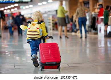 Cute  Baby Boy, Running Late For Boarding To Flight In Airport Transit Hall Near Departure Gate. Active Family Lifestyle Travel By Air With Child On Vacation