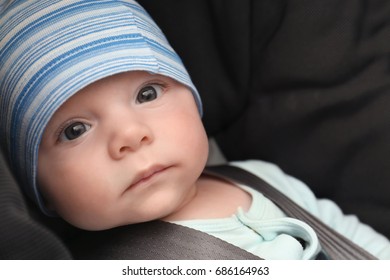 Cute Baby Boy In Safety Car Seat, Closeup