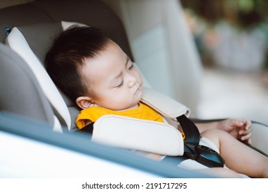 Cute Baby Boy Sleeping On Car Seat. Safe Driving Concept.