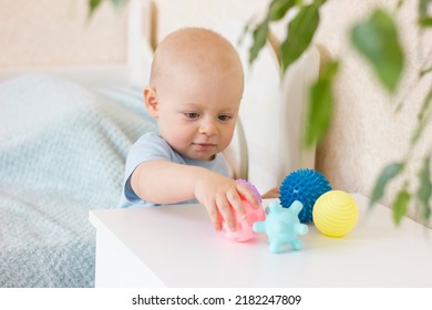 Cute Baby Boy Toddler Playing With Massage Ball. Sensory Or Tactile Activities. Children Health. Massage Textured Balls For Kids. Earlier Development. Focus Picked.