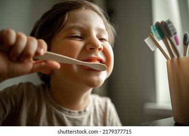 Cute baby brushing his teeth in the bathroom. The child observes hygiene, healthy lifestyle - Shutterstock ID 2179377715