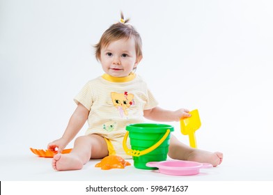 Cute Baby With Bucket And Spade Isolated On White Background