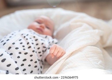 Cute Baby Cam On A White Blanket