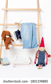 Cute Baby Clothes Hanging On The Rack. Organic Cotton Kids Apparel Mockup.