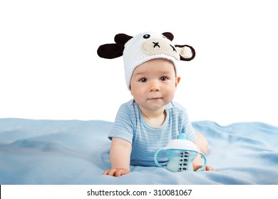 Cute Baby In A Cow Hat Drinking Milk
