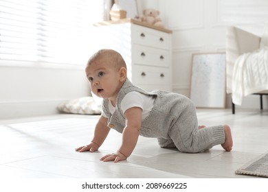 Cute Baby Crawling On Floor At Home