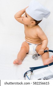 Cute Baby Doctor With A Stethoscope And A Book