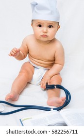 Cute Baby Doctor With A Stethoscope And A Book