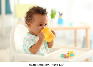 Cute Baby Drinking Water Indoors