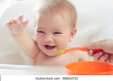 Cute Baby Eating Puree