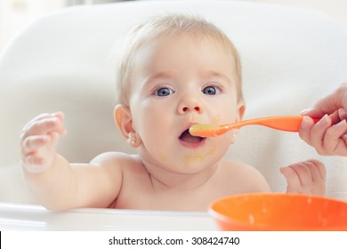 Cute Baby Eating Puree