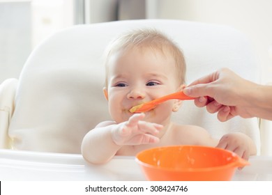 Cute Baby Eating Puree