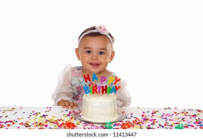 Cute baby girl and a birthday cake