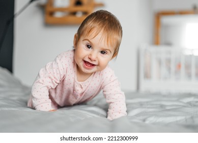 Cute Baby Girl Crawling On The Bed