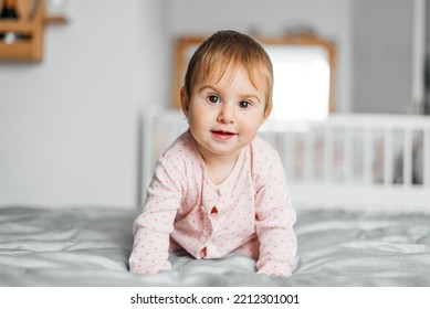 Cute Baby Girl Crawling On The Bed