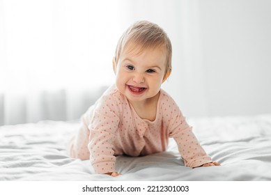 Cute Baby Girl Crawling On The Bed