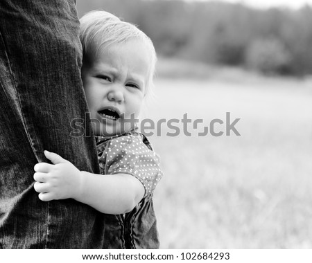 Similar – Image, Stock Photo scared boy hiding in his mom’s dress