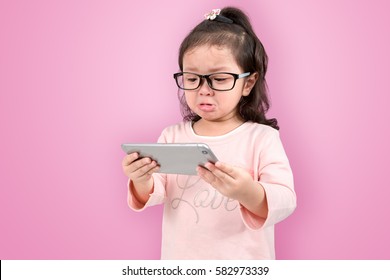 Cute Baby Girl Crying While Playing A Smart Phone, Smart Phone Has A Negative Impact On Your Child’s Development And Mental Health