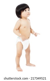 Cute Baby Girl In A Diaper Standing And Looks Up Isolated On White Background