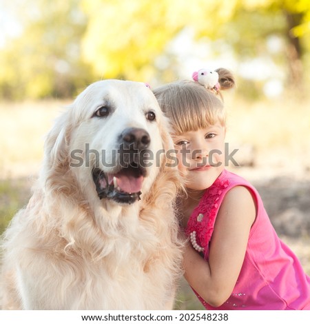 Cute Baby Girl Holding Labrador Outdoors Stock Photo Edit Now