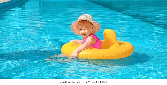 Cute baby girl with inflatable ring in swimming pool - Powered by Shutterstock