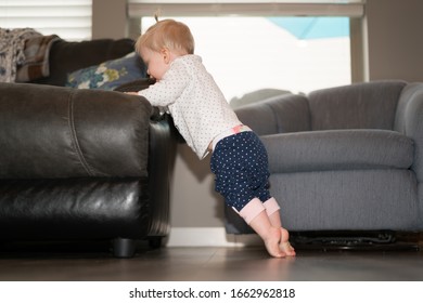 Cute Baby Girl Learning To Stand On Feet - Curled Toes