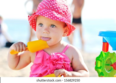 Cute Baby Girl On The Beach
