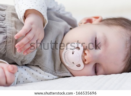 Similar – Baby asleep while parents caress