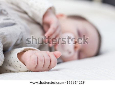 Similar – Baby asleep while parents caress