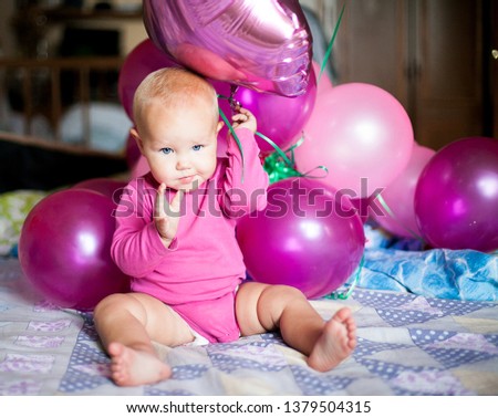 A cute baby girl playing at home