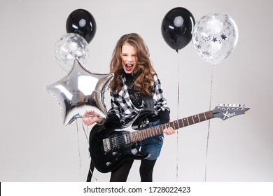 Cute Baby Girl Rock Star Playing Electric Guitar And Singing Song Surrounded By Balloons