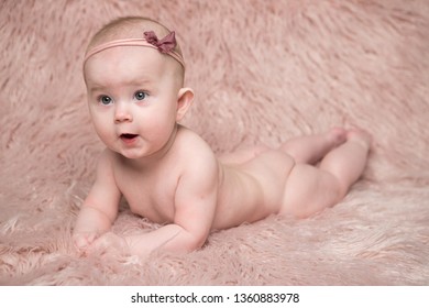 Cute Baby Girl. A Series Of Photos With Her Growing Up. Studio Light. Pink Color Palette.