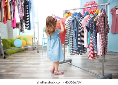 Cute Baby Girl In Baby Shop Store