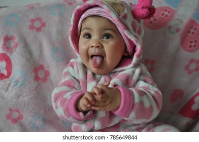 Cute Baby Girl Sticking Out Tongue