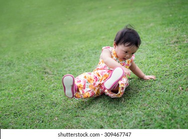 Cute Baby Girl Try To Walk And Fall Down In The Park