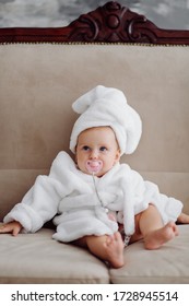 Cute Baby Girl In White Bathrobe