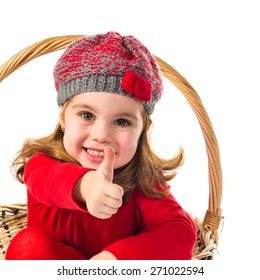 Cute Baby Inside Basket With Thumb Up 