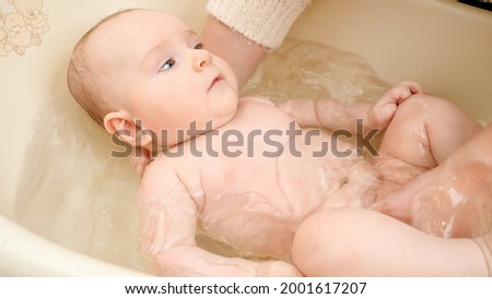 Newborn in the bathtub