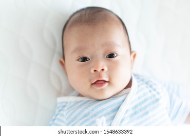 Happy Baby Girl Portrait On Bed Stock Photo (Edit Now) 769534333