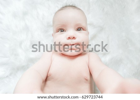 Baby girl four months old having her bath