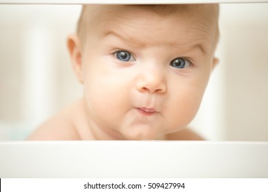 Cute Baby Making A Funny Wondering Face With His Eyebrows, Looking Interested. Family, Baby Development Concept Photo, Close Up