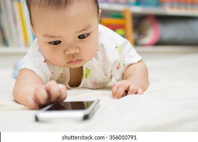 Cute Baby Playing A Smart Phone,asian Baby