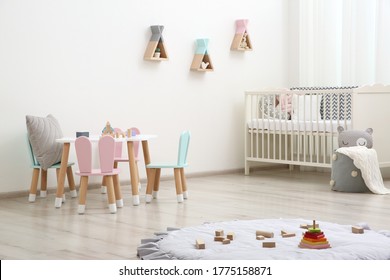 Cute Baby Room Interior With Cot And Little Table