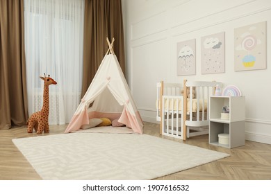 Cute Baby Room Interior With Crib And Play Tent